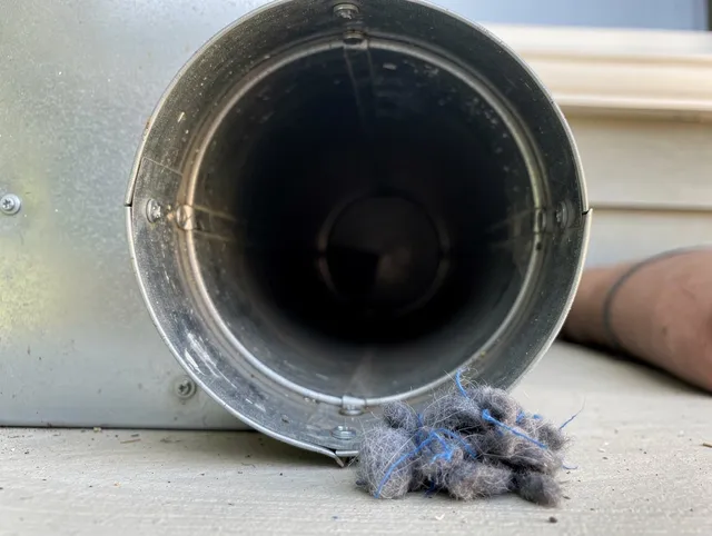Parma Heights Dryer Vent Cleaning technician using specialized equipment to clear severe dryer vent blockage in Parma Heights
